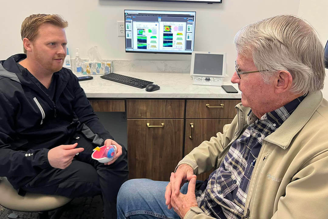 Dr. Mueller Talking With a Patient